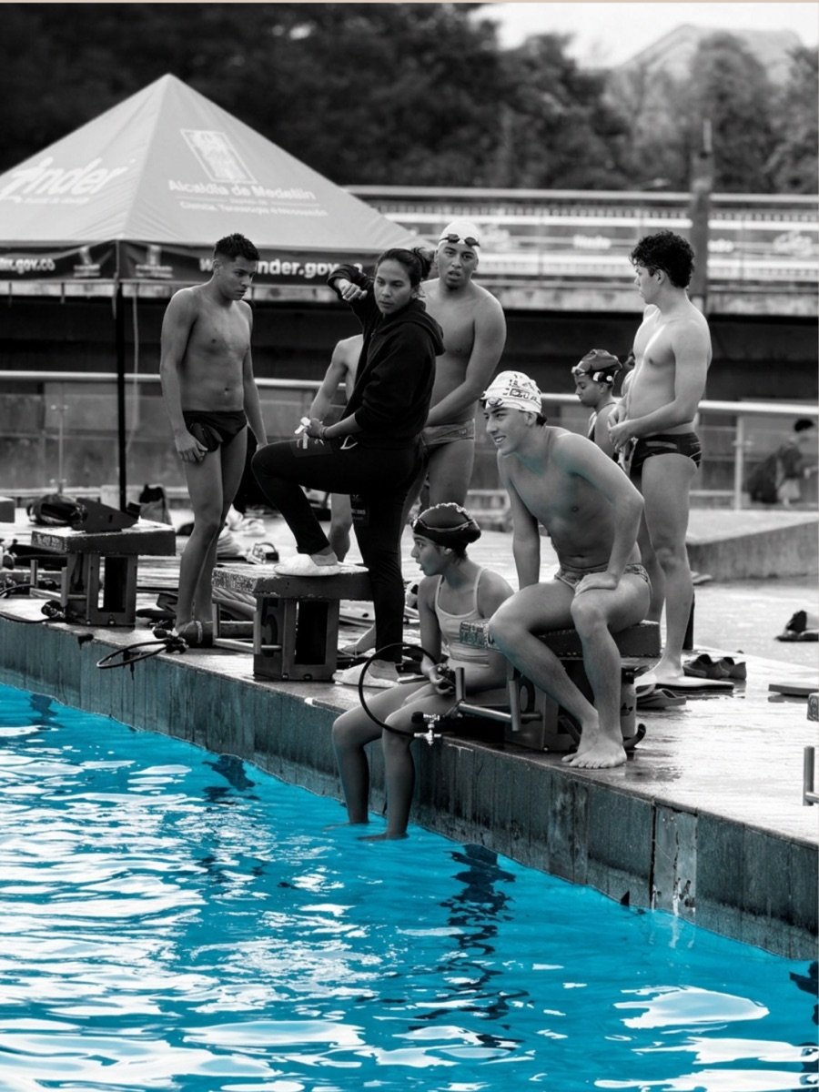 A group of finswimmers gathered at the pool edge before training