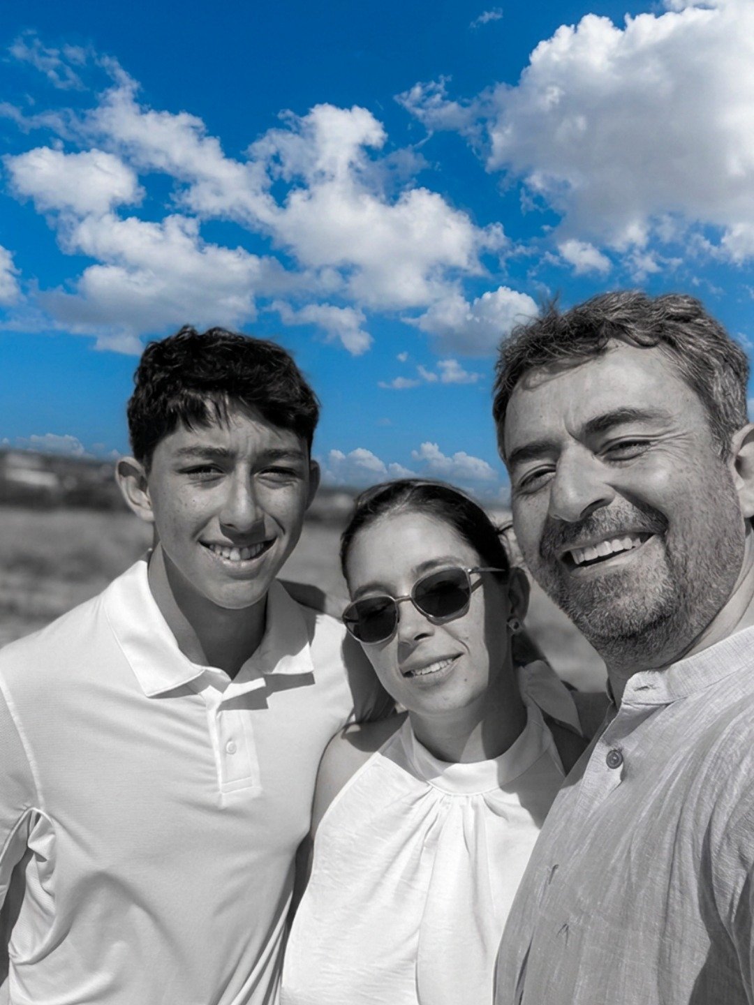 Konsta as a teenager with his parents, outdoors